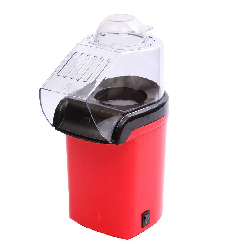 Red popcorn maker with clear lid on a white background
