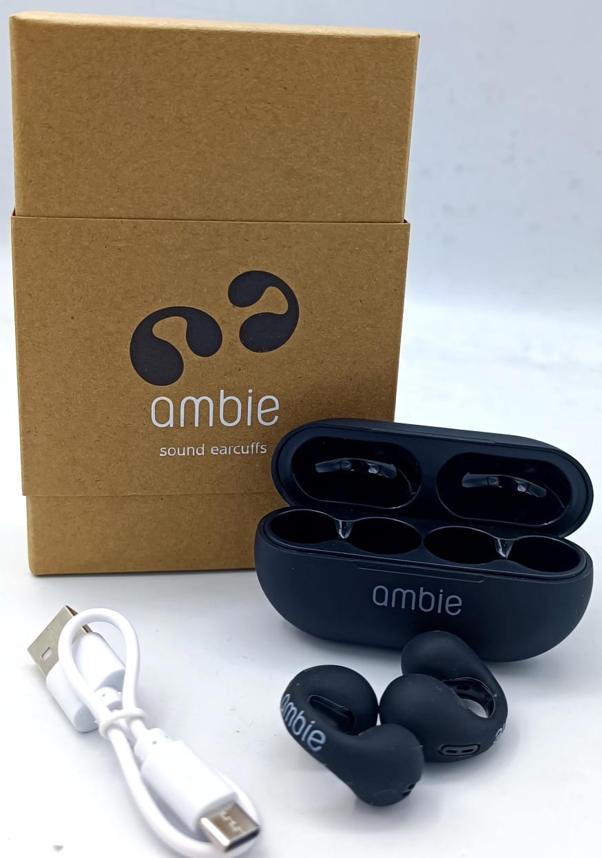 Ambie earbud packaging with earbuds, case, and USB cable on a white background