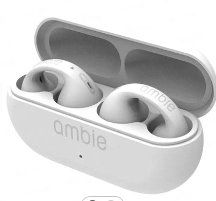 White wireless earbuds in a gray case with 'ambie' branding on a white background