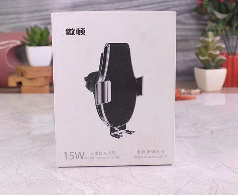 Product packaging box with a car mount holder on a textured surface.