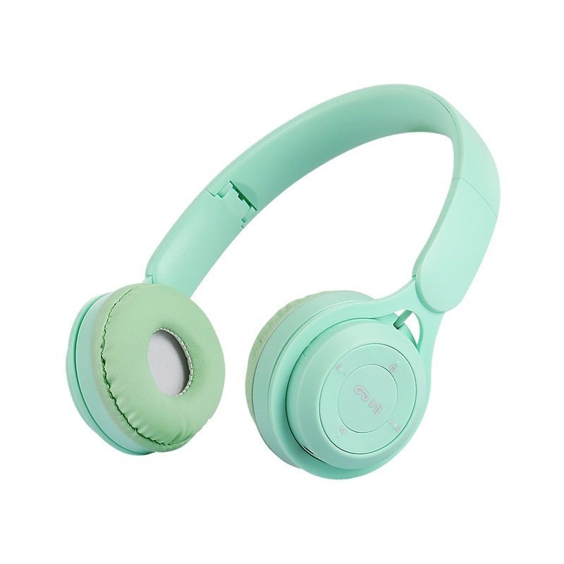 Mint green headphones on a white background