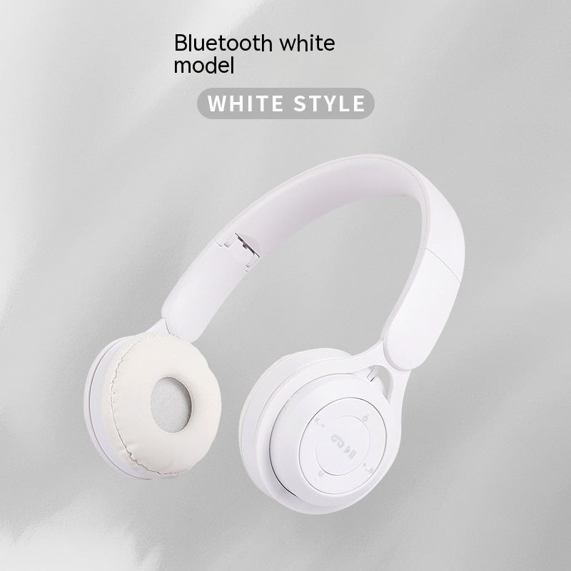 White Bluetooth headphones on a light gray background